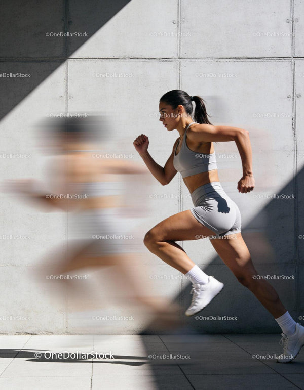 Athletic woman sprinting with dynamic motion blur
