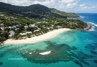 Tropical Beach with Turquoise Waters and Lush Greenery