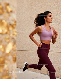 Active woman running outdoors wearing fitness gear