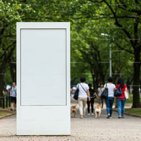 Blank white street billboard in green park alley