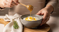 Honey Drizzling Over Yogurt in Ceramic Bowl for Breakfast
