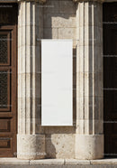 Blank vertical banner on historic stone facade