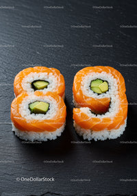 Salmon Avocado Sushi Rolls on Black Slate Plate