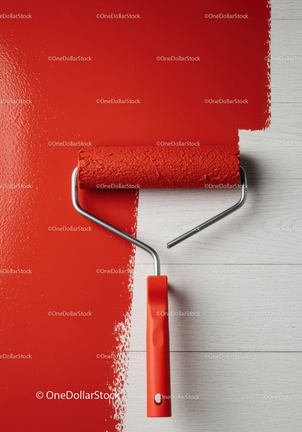 Red Paint Being Applied with Roller on Wall in Interior Space