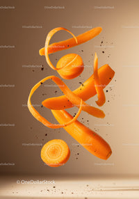 Fresh peeled carrots and slices suspended in air