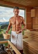 Mature Man Enjoying Sauna in Wooden Wellness Spa Room