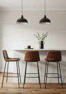 Elegant Modern Kitchen with Black Pendant Lights and Brown Bar Stools