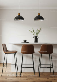 Elegant Modern Kitchen with Black Pendant Lights and Brown Bar Stools