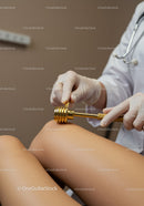 Physiotherapy Session Using Gold Massage Roller on Leg