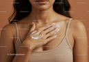 Close-up of Woman Applying Lotion on Chest with Soft Skin and Relaxed Mood