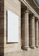 Blank White Poster on Classical Stone Building Columns