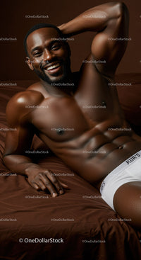 Relaxed smiling man reclining on bed in white underwear