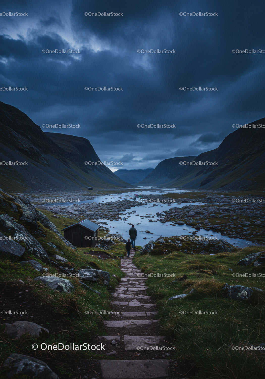 Two hikers walking on stone path by mountain river
