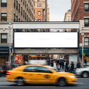 Busy city street with yellow taxi and blank billboard