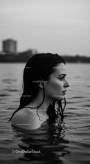 Serene Female Portrait in Water with Urban Background