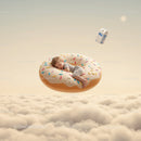Sleeping toddler resting on giant sprinkled donut in sky