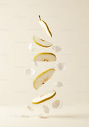 Floating Slices of Pear with Delicate White Petals