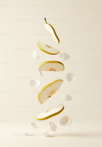 Floating Slices of Pear with Delicate White Petals