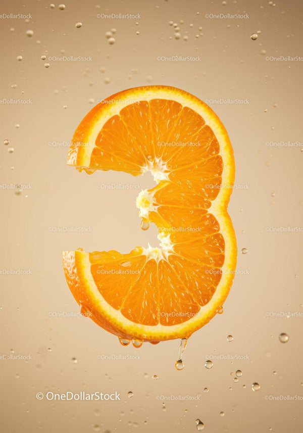 Fresh orange slice shaped as number three with water droplets