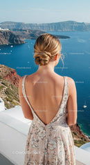 Woman in floral dress overlooking serene coastal cliffs