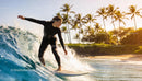 Woman Surfing on Ocean Wave at Tropical Beach