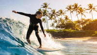 Woman Surfing on Ocean Wave at Tropical Beach