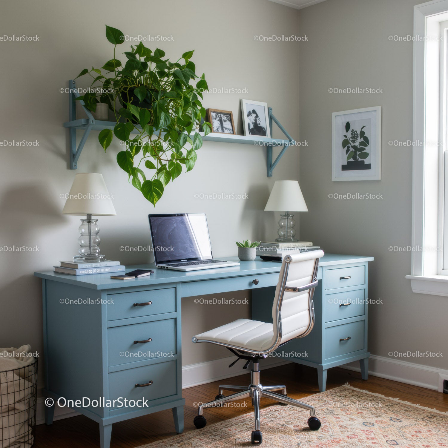 Blue Desk with Potted Plant and Laptop in Modern Home Office