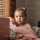 Young Girl Resting in Cozy Bedroom with Wooden Blinds