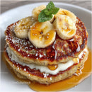 Banana Pancakes with Caramel Syrup and Mint Garnish