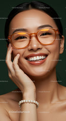 Smiling woman with orange glasses and pearl bracelet