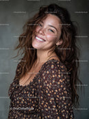 Bright Smiling Woman with Wavy Hair in Casual Floral Top