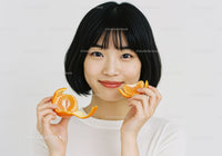 Close-up of Happy Woman Enjoying Fresh Tangerine Slices for Healthy Lifestyle
