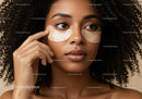 Close-up of Woman with Curly Hair Wearing Eye Patches for Skincare