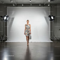 Young woman walking confidently in floral summer dress