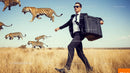 Businessman Running with Briefcase Amid Flying Tiger Silhouettes in Field