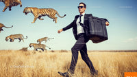 Businessman Running with Briefcase Amid Flying Tiger Silhouettes in Field