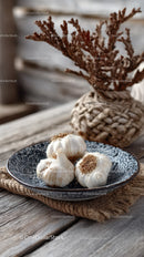 Fresh Garlic Bulbs on Ceramic Plate with Rustic Botanical Decor