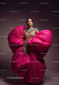 Fashion Model in Vibrant Pink and Yellow Flowing Gown