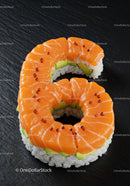 Salmon sushi roll shaped as number six on black plate
