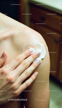 Applying Moisturizing Cream on Shoulder for Smooth Skin
