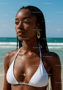 Elegant Woman in White Bikini and Gold Jewelry at Beach