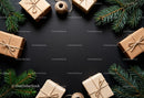 Eco Friendly Wrapped Gifts with Pine Branches on Black
