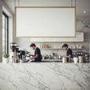 Barista preparing coffee in modern marble cafe interior
