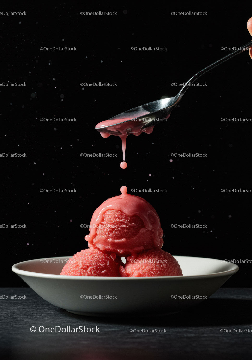 Refreshing red sorbet scoops with dripping sauce