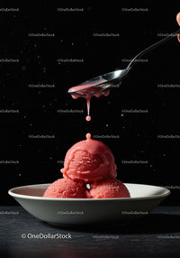 Refreshing red sorbet scoops with dripping sauce