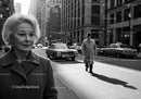 Elderly Businesswoman Walking Across City Street in Black and White