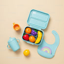 Colorful toddler lunchbox with toy fruit and feeding accessories