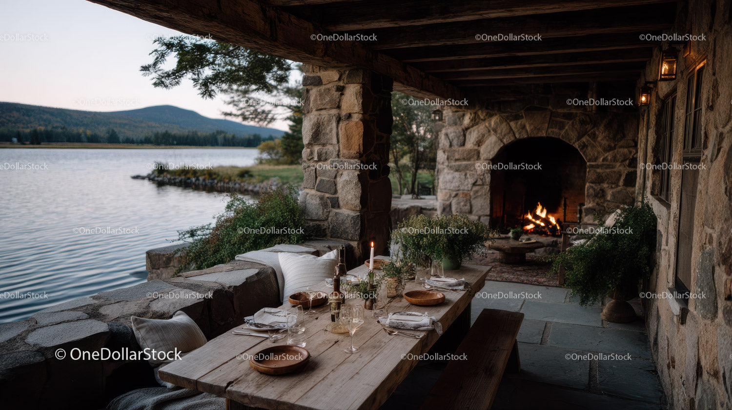 Cozy Outdoor Dining Area by Lake with Stone Fireplace and Scenic Views