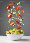 Fresh garden vegetables floating into white bowl salad