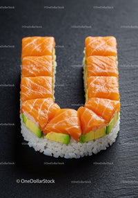 Sushi roll shaped like the letter U with salmon